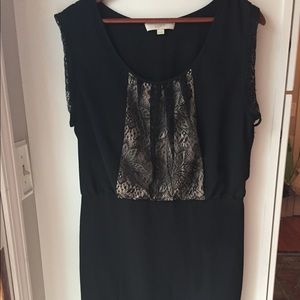Black dress with nude fabric and black lace chest.
